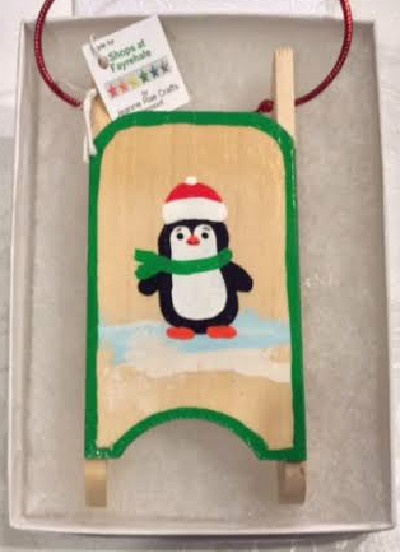 Penguin sled ornament